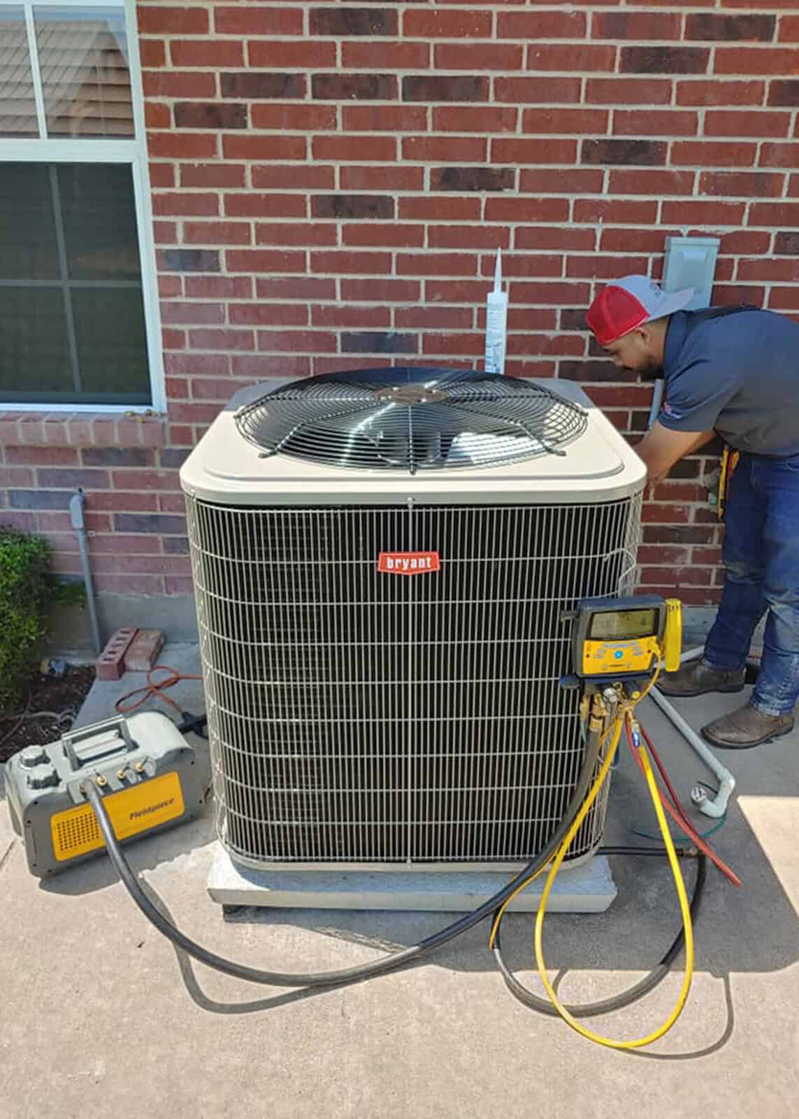 Certified Bolton technician troubleshooting a central air‑conditioner in Forney, TX.