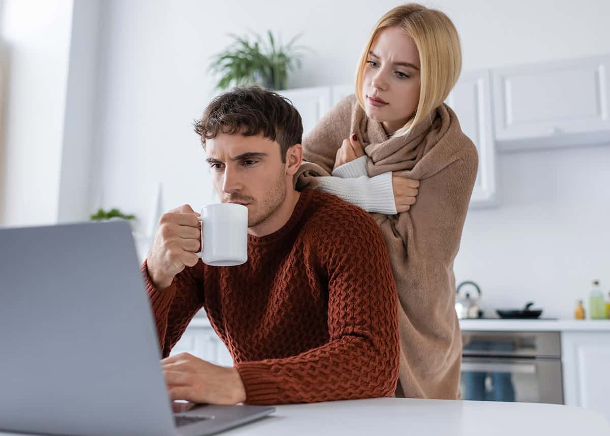 Couple researching the difference between heat pumps and furnaces