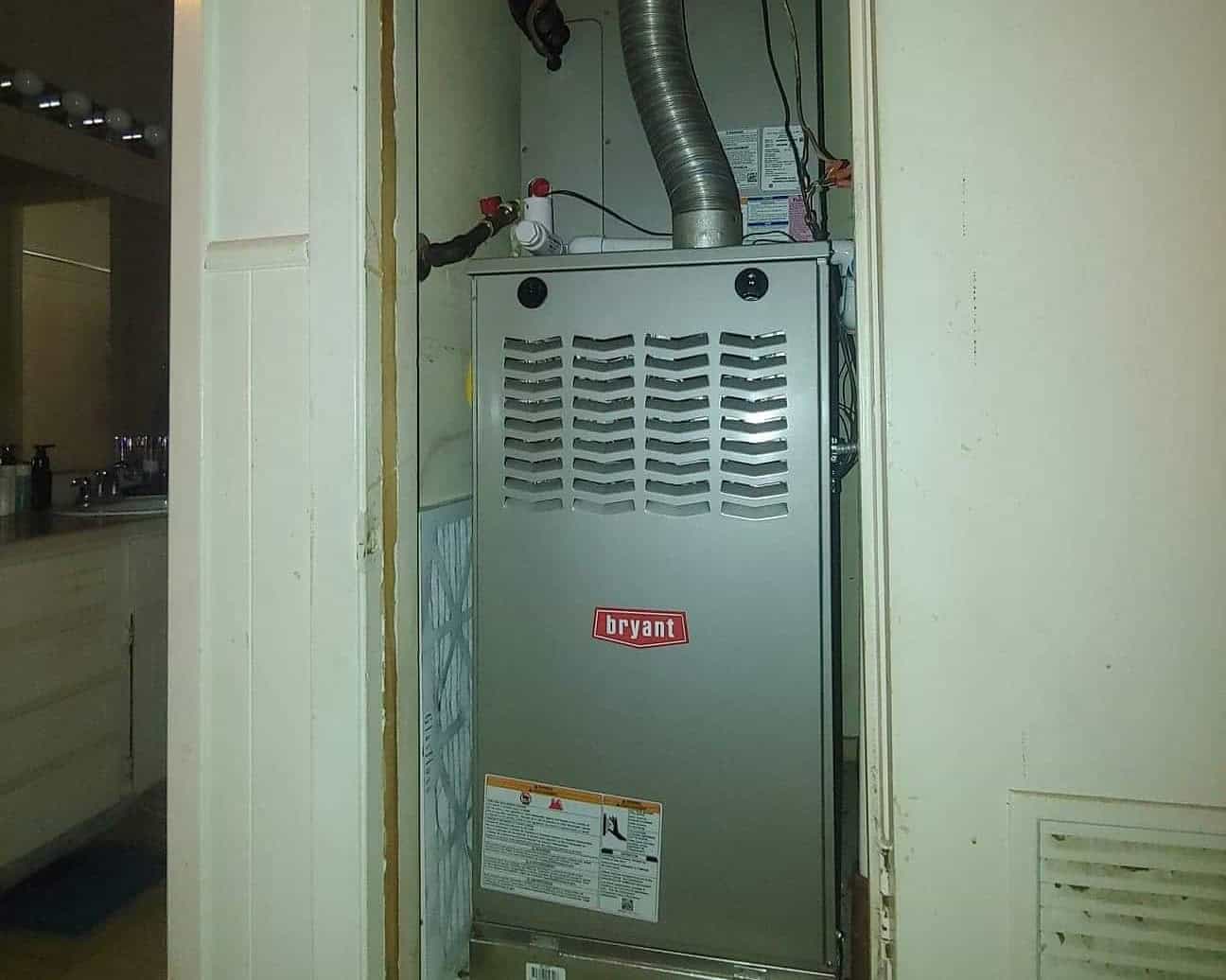 Bolton Heating and Air repairing a faulty furnace at a home in Forney