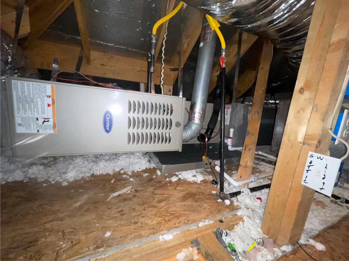 A newly installed gas furnace in a Texas attic showing proper ductwork, gas line, and venting—used to illustrate factors that impact new furnace replacement cost for homeowners.