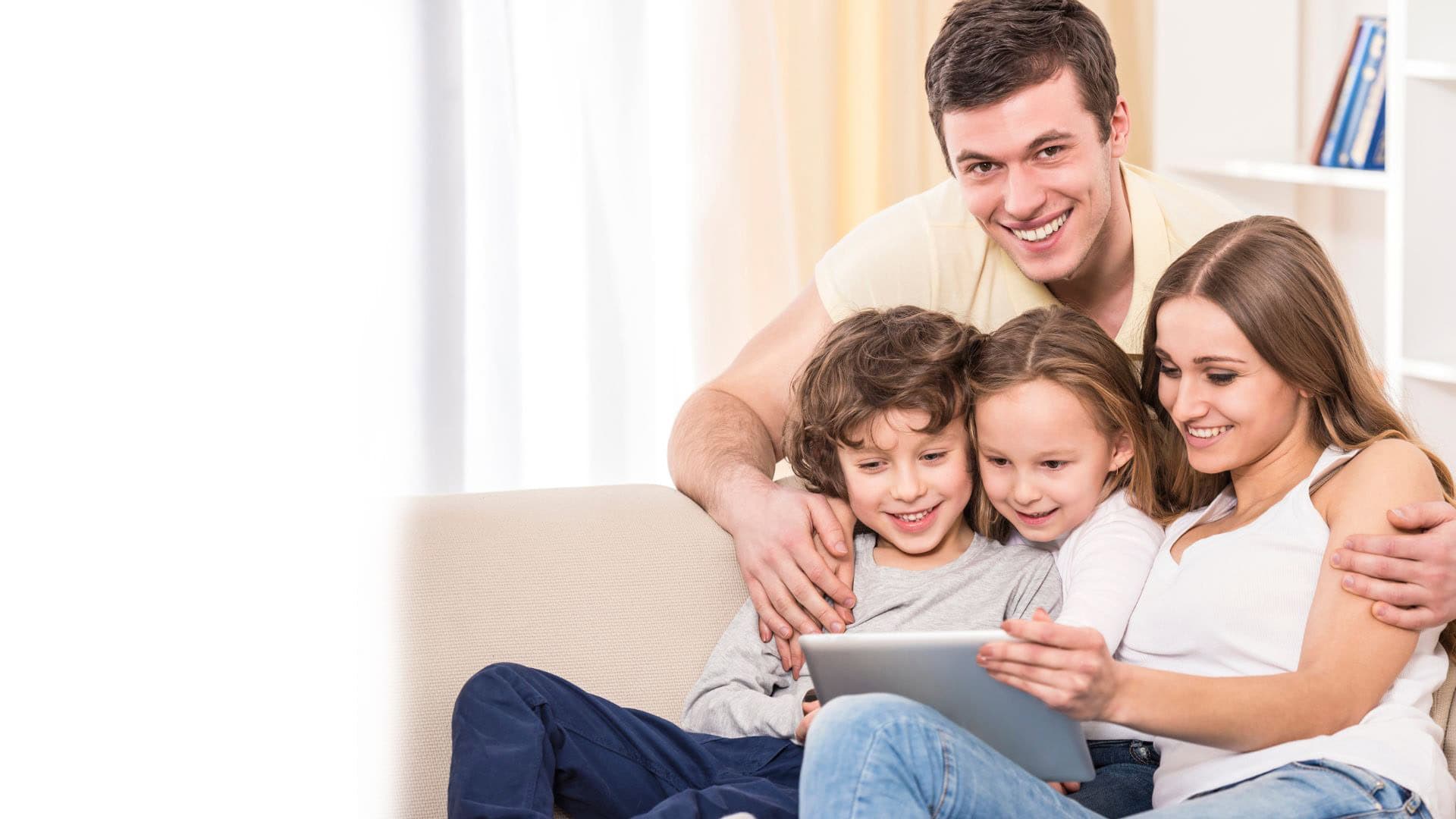 Family seeking relief from the heat in their living room. Bolton Heating & Air: Fast and Reliable AC Repair in Forney, TX.