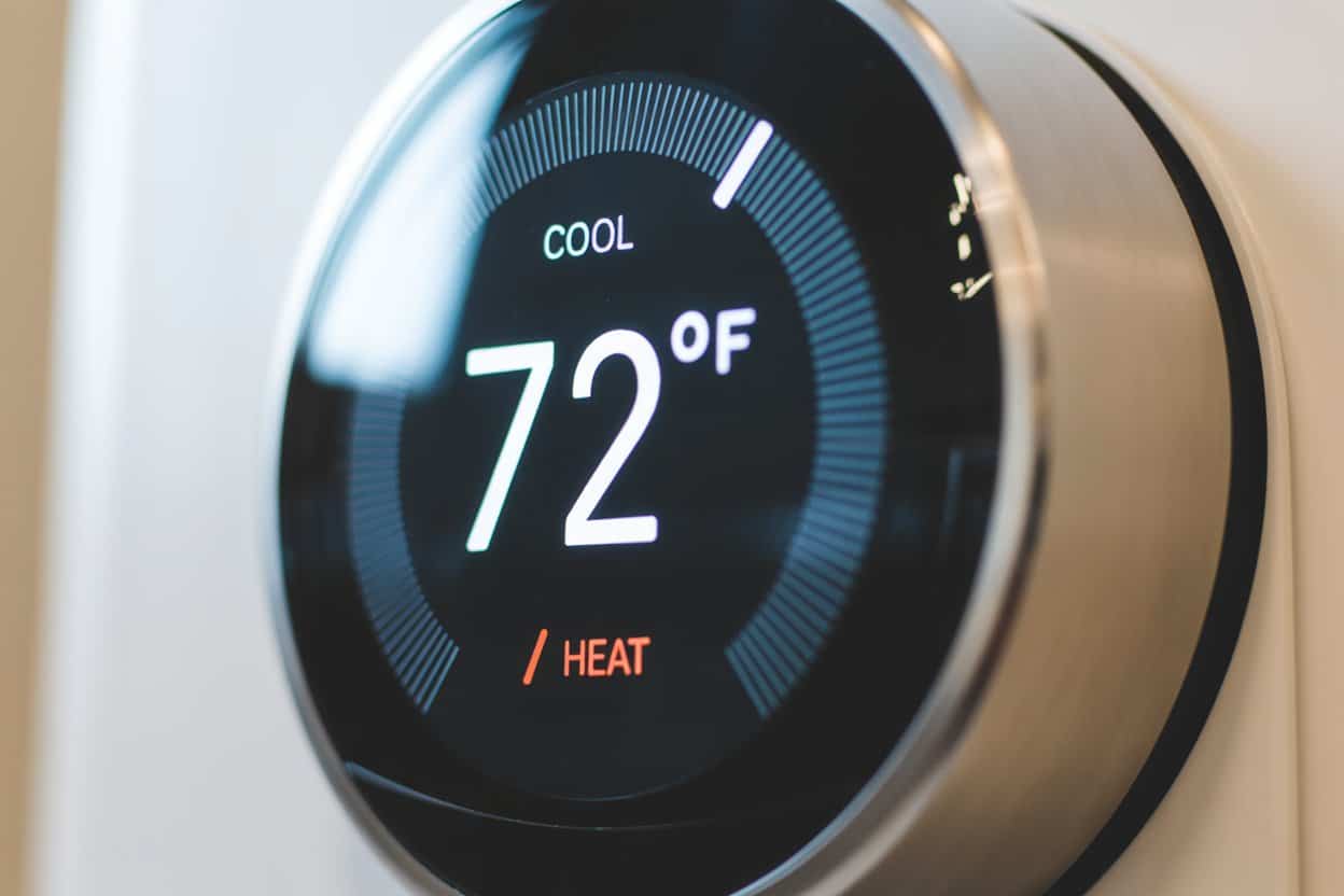 Close-up of a smart thermostat switching from cool to heat mode at 72°F, representing an electric furnace troubleshooting issue in a Sunnyvale TX home.